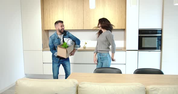 Couple Having Fun in New Flat