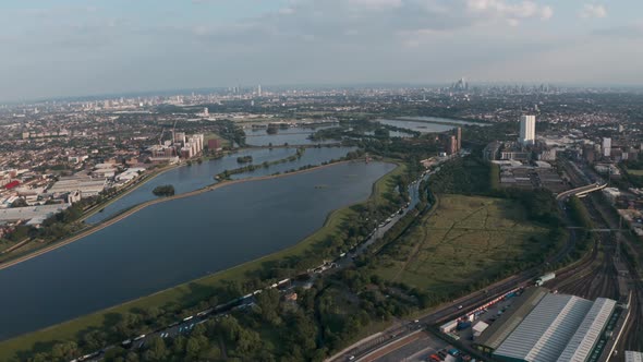 Circling drone shot over north London water reservoirs Walthamstow Tottenham alt