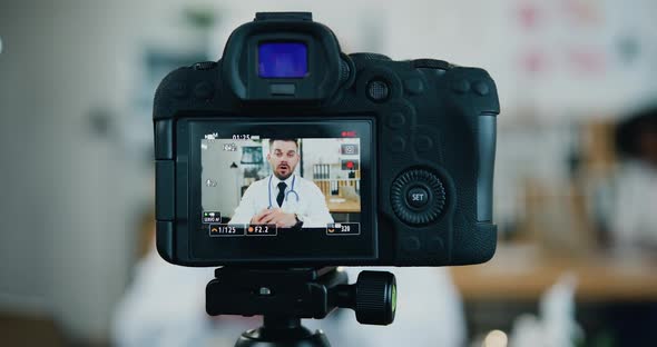 Doctor which Recording His Medical Vlog in Own Medical Office for Internet Channel alt