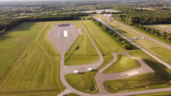 Aerial View Of Bosch Testing Grounds Surrounded With Green Trees In Flat Rock, Michigan, USA. alt
