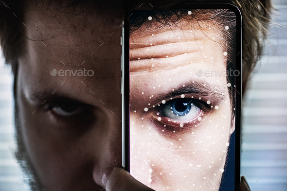 A smartphone using face ID recognition system.