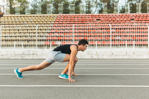 Young sportsman is ready to run outdoors in the morning. - Stock Photo - Images