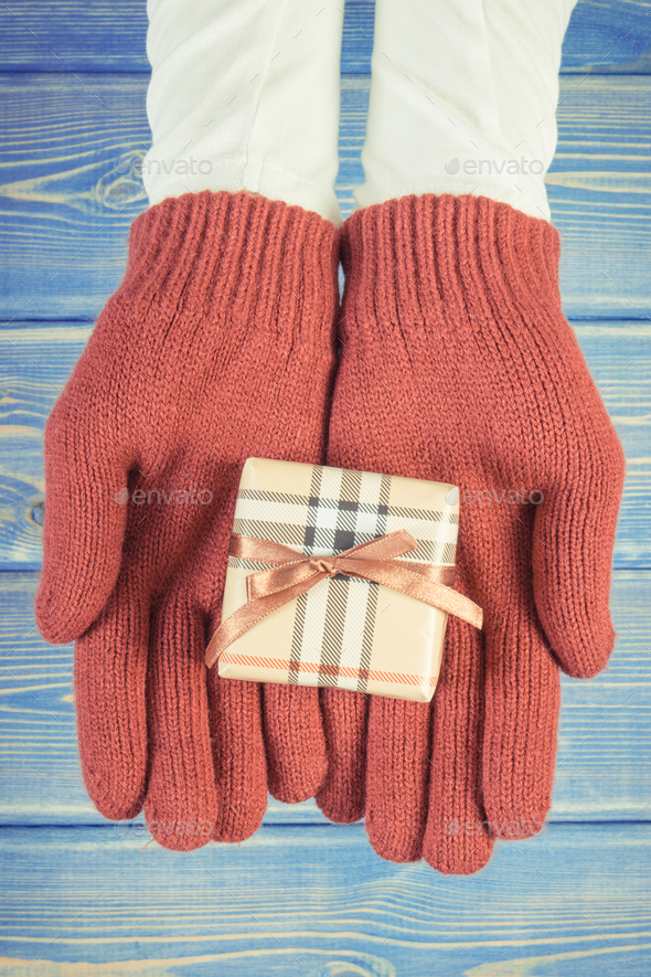 Vintage photo, Hands of woman with gift for Christmas or other celebration - Stock Photo - Images