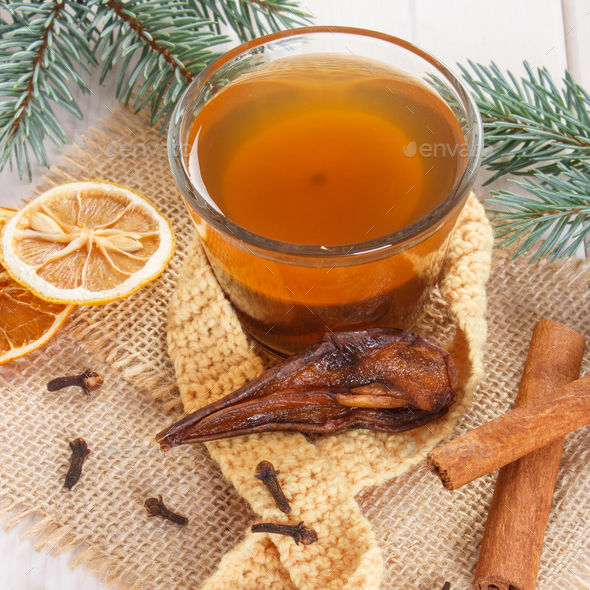 Spruce branches and cup of traditional compote of dried fruits for Christmas - Stock Photo - Images