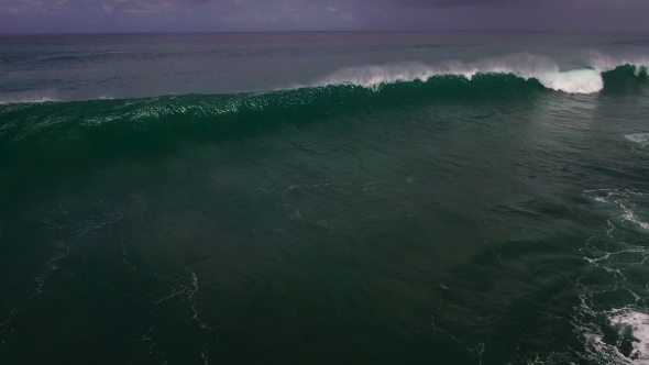 Aerial Drone  Footage of Ocean Waves Breaking Before the Shore. Bali, Indonesia