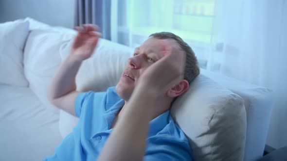 Portrait of a Relaxed Young Man with His Hands Behind His Head Comfort Zone alt