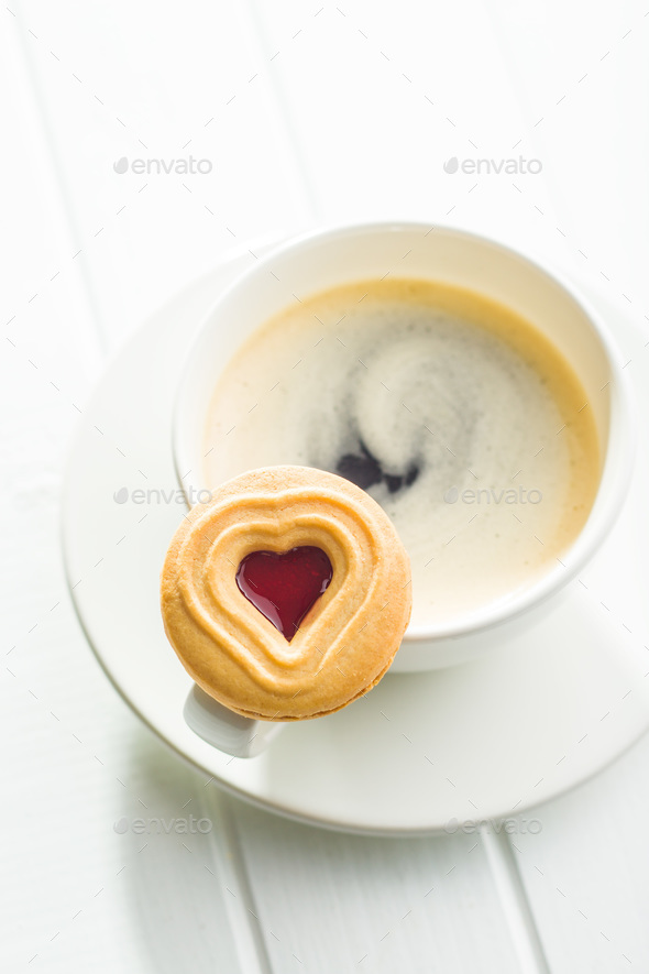 Sweet jelly cookies and coffee cup.