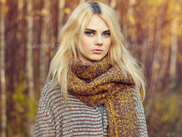 Portrait of young beautiful woman in autumn pullover - Stock Photo - Images