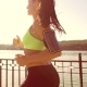 A Sports Girl Runs Through the Park By the Lake - VideoHive Item for Sale