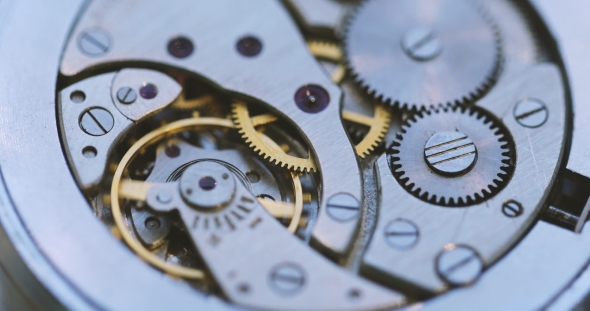 Gears And Mainspring In The Mechanism Of A Watch alt