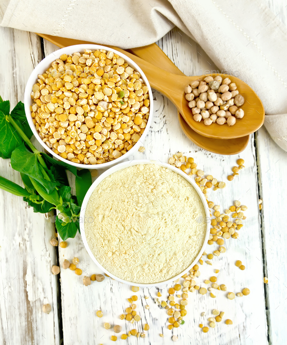 Flour pea and split pease in bowls on board top - Stock Photo - Images