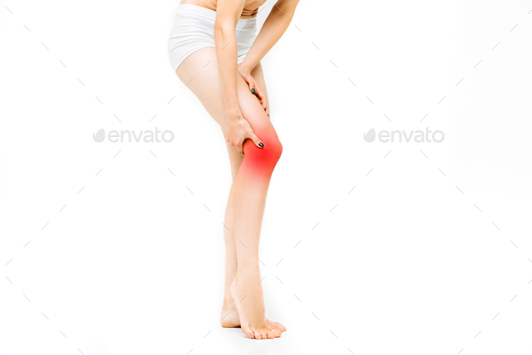 Joint ache, female person with leg stretching - Stock Photo - Images