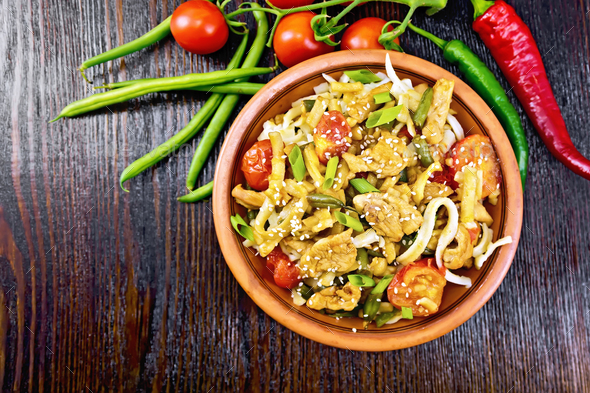 Noodles wok Thai in plate on board top - Stock Photo - Images