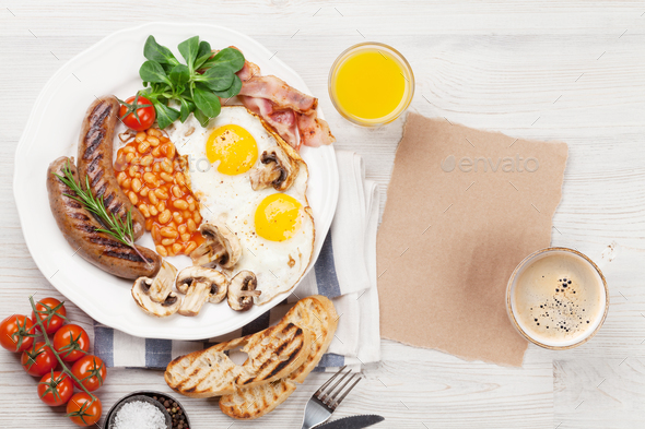 English breakfast. Fried eggs, sausages, bacon - Stock Photo - Images