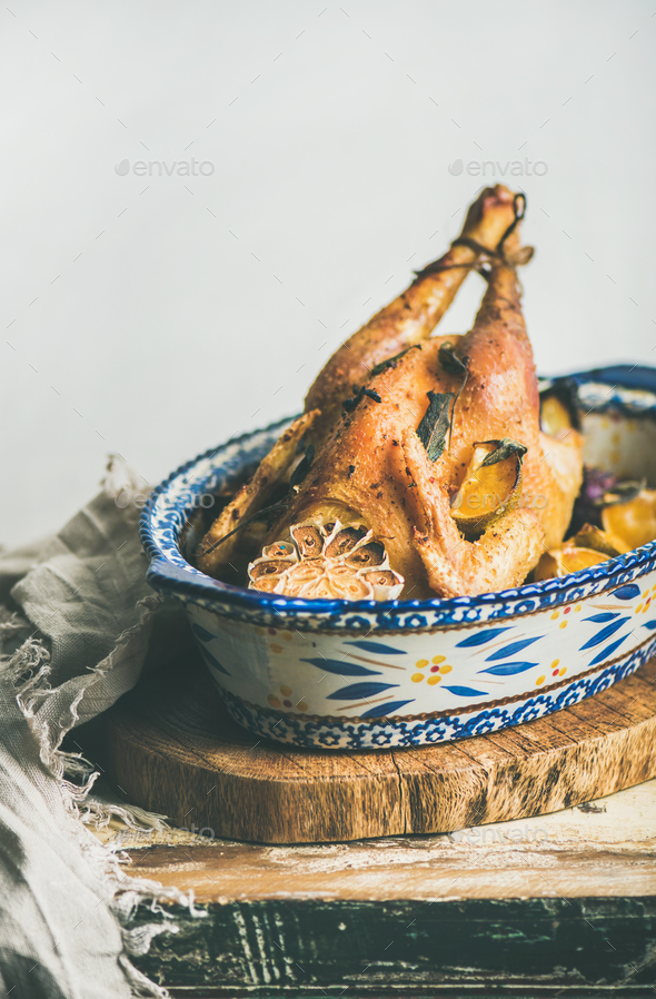 Roasted whole chicken with garlic and oranges for Christmas - Stock Photo - Images