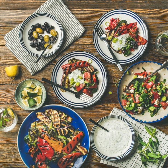 Flat-lay of healthy dinner table setting with snacks - Stock Photo - Images