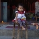 Little Cute Little Girl Is Sitting on a Chair - VideoHive Item for Sale