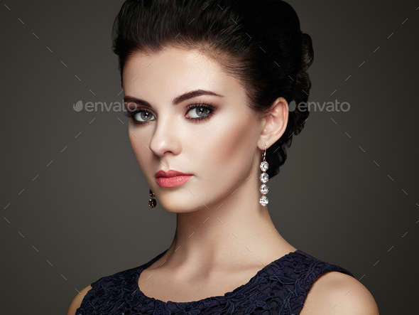 Fashion portrait of young beautiful woman with jewelry - Stock Photo - Images