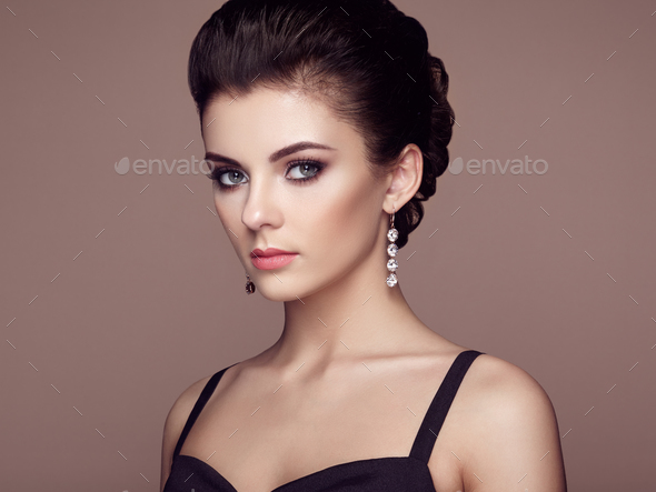 Fashion portrait of young beautiful woman with jewelry - Stock Photo - Images