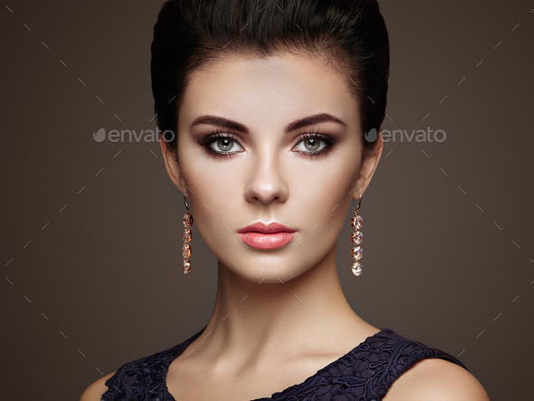 Fashion portrait of young beautiful woman with jewelry - Stock Photo - Images