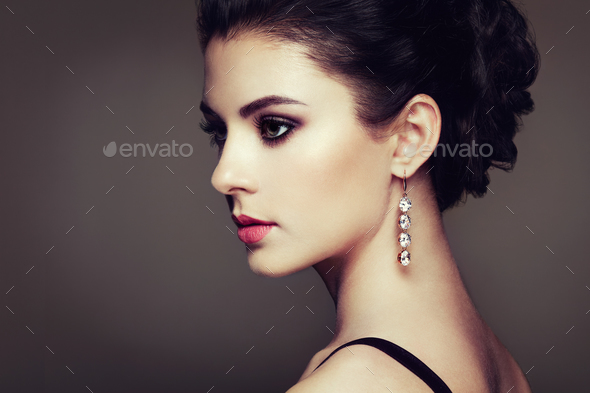 Fashion portrait of young beautiful woman with jewelry - Stock Photo - Images
