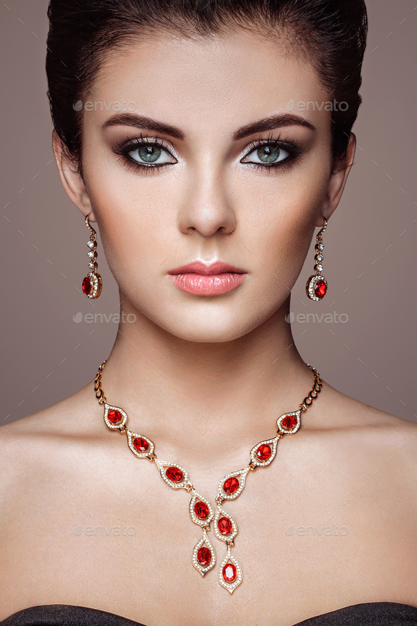 Fashion portrait of young beautiful woman with jewelry - Stock Photo - Images