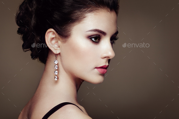 Fashion portrait of young beautiful woman with jewelry - Stock Photo - Images