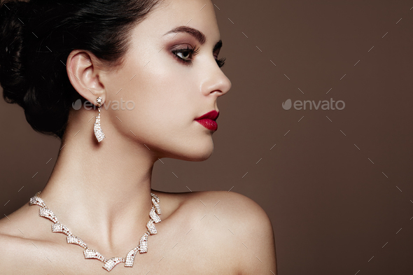 Fashion portrait of young beautiful woman with jewelry - Stock Photo - Images