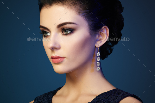 Fashion portrait of young beautiful woman with jewelry - Stock Photo - Images