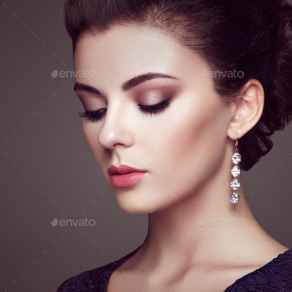 Fashion portrait of young beautiful woman with jewelry - Stock Photo - Images