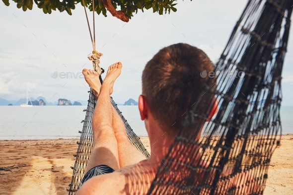 Man relaxing in the hammock - Stock Photo - Images