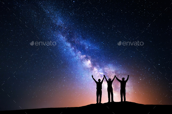 Landscape with Milky Way and silhouette of a happy family - Stock Photo - Images