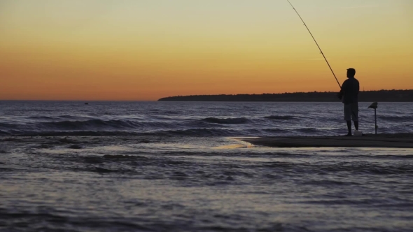 Fisherman with Spinning Silhouette at Sea Sunset