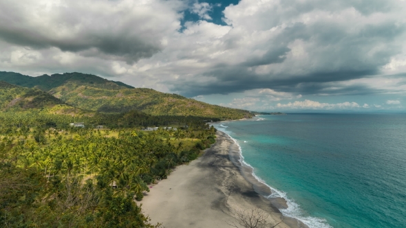 Tropical Sandy Beach with Palm Trees at Sunny Day at the Lombok Island, Indonesia alt
