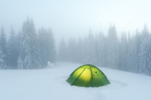 Green tent lighted from the inside - Stock Photo - Images