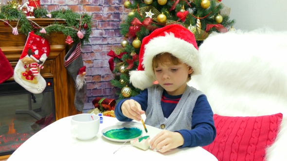 Little Santa's Assistant Colors the Christmas Tree