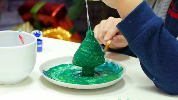 The Boy Completely Painted the Decoration on the Christmas Tree