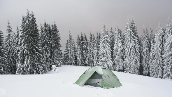 Green Tent in Winter Mountains