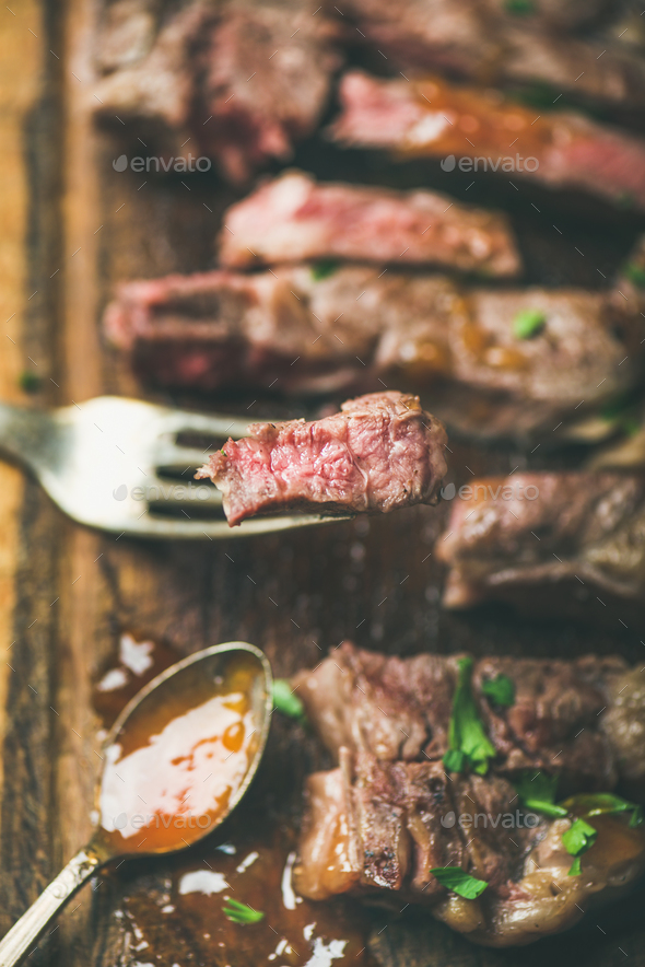 Grilled ribeye beef steak peice on fork - Stock Photo - Images