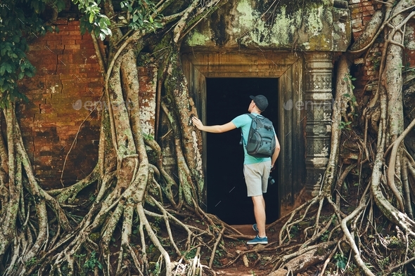 Traveler in the ancient temple - Stock Photo - Images