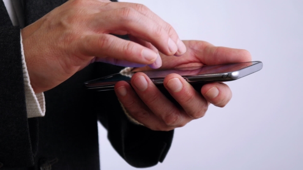 Businessman Reading on Mobile Phone