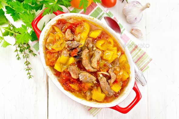 Ragout of meat and vegetables in brazier on board top - Stock Photo - Images
