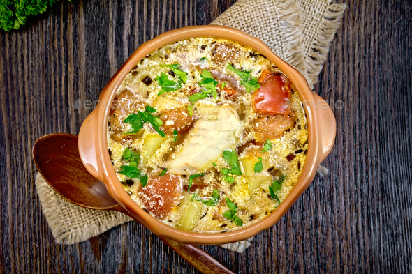 Soup fish with vegetables and cream on board top - Stock Photo - Images