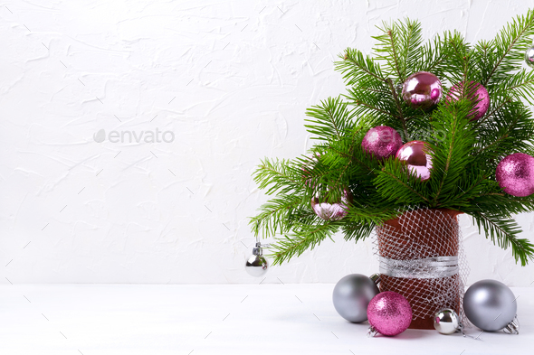 Christmas centerpiece with pink and silver baubles, copy space - Stock Photo - Images