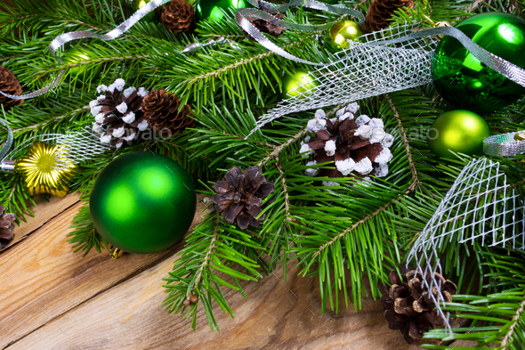 Christmas holiday greeting background with green ornaments - Stock Photo - Images