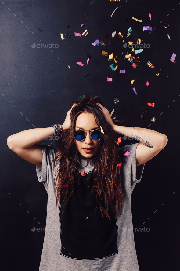 Adorable girl having fun with confetti - Stock Photo - Images