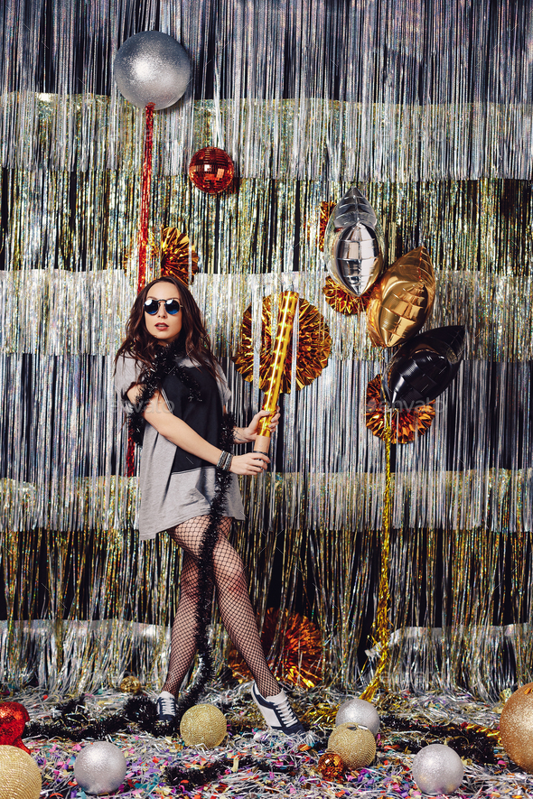 Portrait girl enjoying party and confetti - Stock Photo - Images