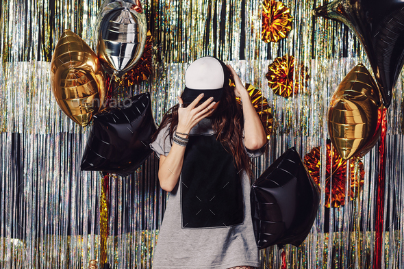Party girl with copyspace on t-shirt and cap - Stock Photo - Images