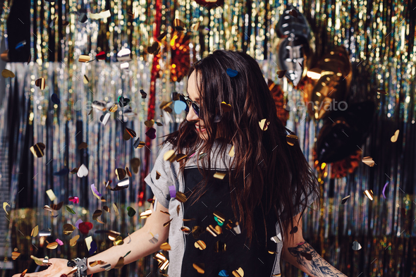 Portrait girl enjoying party and confetti - Stock Photo - Images