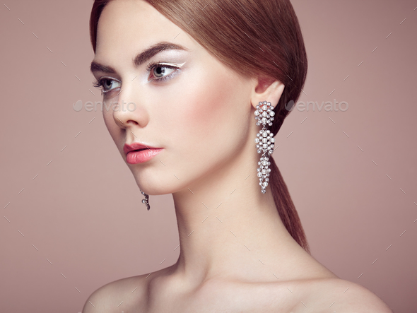 Fashion portrait of young beautiful woman with jewelry - Stock Photo - Images